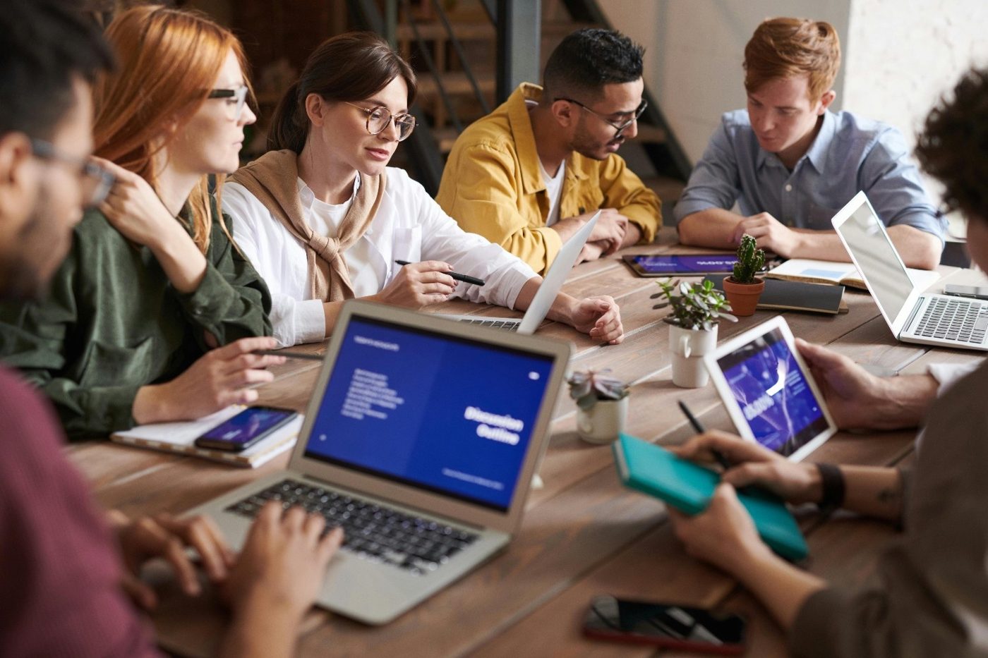 A team working across laptops