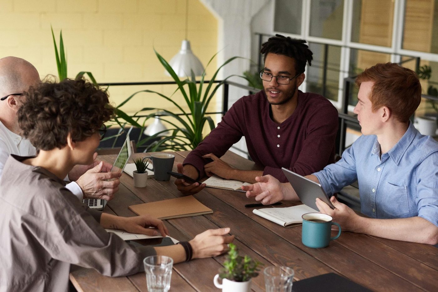 Three colleagues reviewing a document